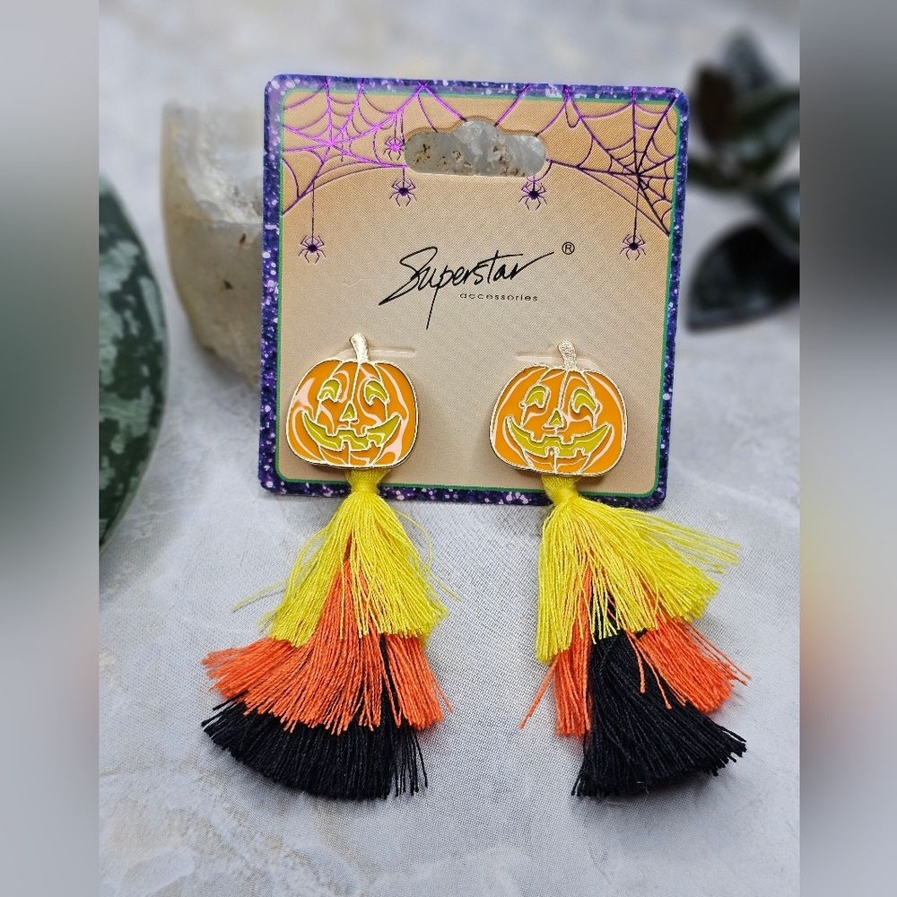 Pumpkin Post earrings with fringe details.